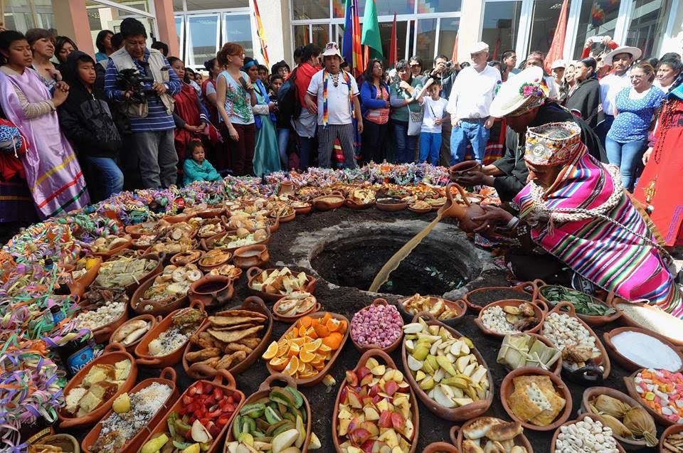 Ecuadorian's taking part in the traditional pamba mesa, a community meal